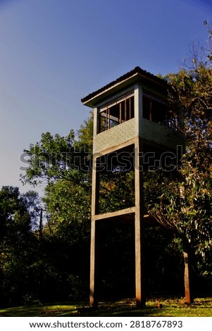 Abandoned sentry box surrounded trees in a park