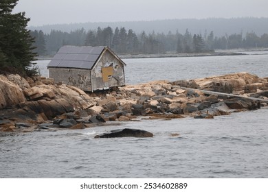 Abandoned shack on rocky coast - Powered by Shutterstock