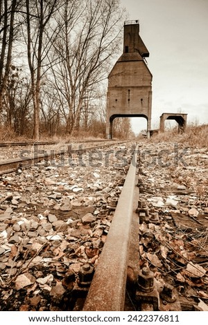Abandoned silo on abandoned railway tracks in the city center