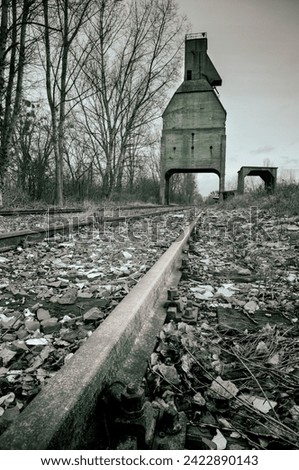 Abandoned silo on abandoned railway tracks in the city center