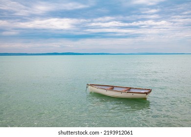 Abandoned Sloop On A Large Lake