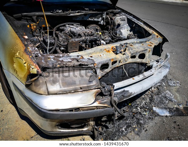 An abandoned, stolen\
burned out car