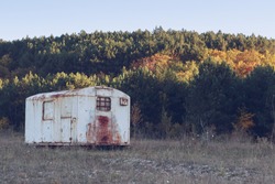 Abandoned Trailer In The Forest. Autumn