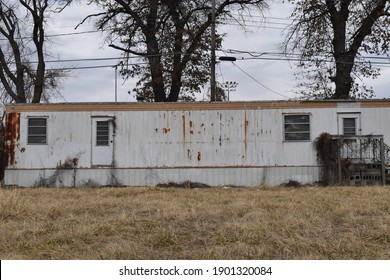 Abandoned Trailer House With A Yard