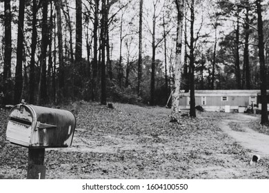 Abandoned trailer and tilted mailbox, rustic look, in suburban Mississippi