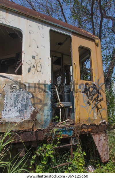 An abandoned\
train car in central\
Thailand.
