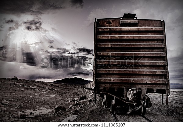 abandoned train cars\
in a horror scene, dawn zombie similar to video games with sunbeams\
filtering the clouds