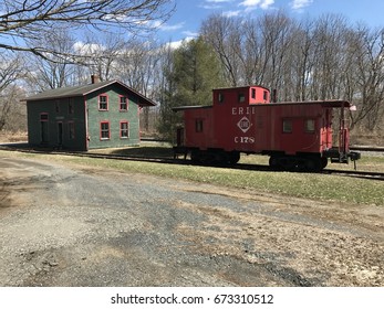 Abandoned Train Station And Erie Railroad Caboose 