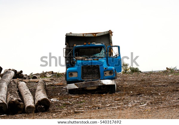Abandoned truck\
rusting away waiting for\
recycling.