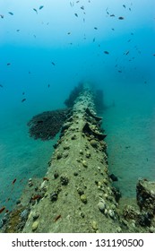 An Abandoned Underwater Pipeline Stretches Off Into The Distance