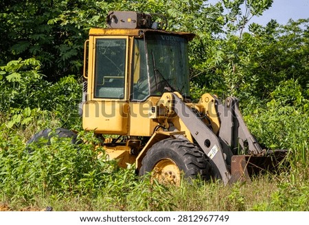 Abandoned Volvo front loader in the Amazon rainforest region of Brazil.