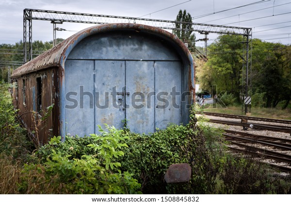 Abandoned wagon on a\
railroad