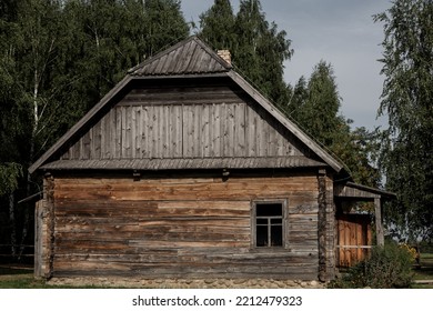 Abandoned Wooden House In Village. Old Rustic Architecture.