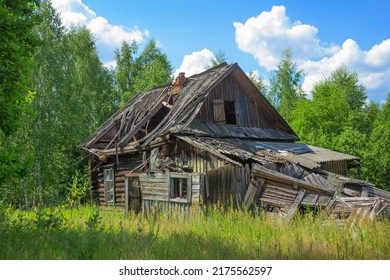 An abandoned wooden old house  desolation   ruin  an old village house among the trees In  fores