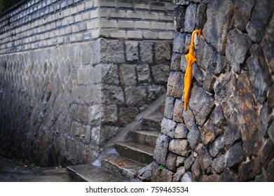 Abandoned Yellow Umbrella In Rain