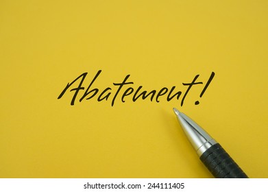 Abatement! note with pen on yellow background
