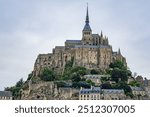 Abbey Mont Saint-Michel (VII century) at rocky tidal island in Normandy - one of most visited tourist sites in France. Normandy, Northern France, Europe.