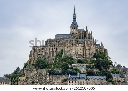 Abbey Mont Saint-Michel (VII century) at rocky tidal island in Normandy - one of most visited tourist sites in France. Normandy, Northern France, Europe.