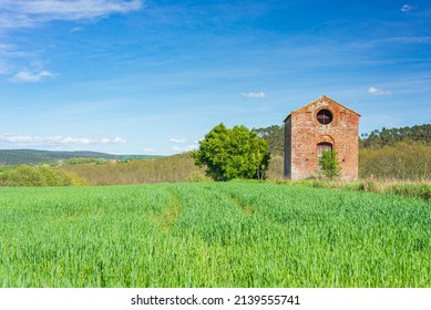 Abbey of San Galgano, Italy - circa May, 2021: a small chapel near Abbazia di San Galgano (original name), the ruin of an ancient cathedral with collapsed roof, tourism destination in Tuscany, Italy.