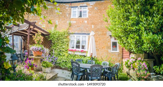 Abbotsbury, Dorset / England - July 7, 2019: Beautiful traditional houses and cottages in the town of Abbotsbury, in England