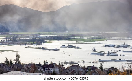 Abbotsford, Greater Vancouver, British Columbia, Canada - November 17, 2021: Devestating Flood and black smoke from fire in the city and farmland after storm.