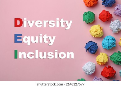 Abbreviation DEI - Diversity, Equity, Inclusion And Colorful Paper Balls On Pink Background, Flat Lay