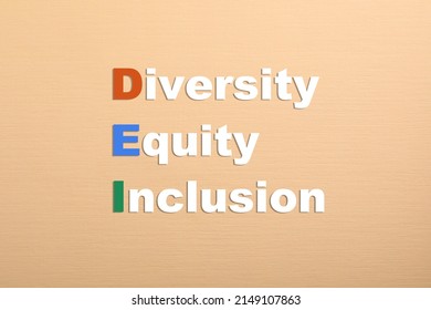 Abbreviation DEI - Diversity, Equity, Inclusion On Beige Background