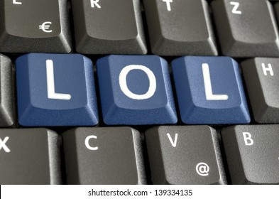 Abbreviation LOL written with blue keys on computer keyboard.