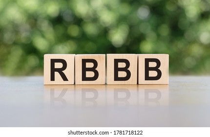 Abbreviation RBBB (right Bundle Branch Block) Text Acronym On Wooden Cubes On Wooden Table. Medicine Concept.