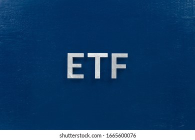 The Abbreviation Word Etf - Exchange Traded Fund - Laid With Silver Letters On Blue Color Flat Surface