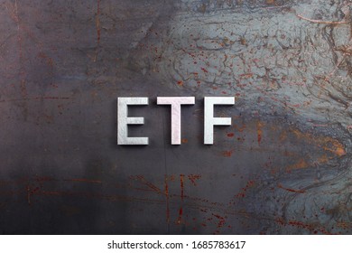 The Abbreviation Word Etf - Exchange Traded Fund - Laid With Silver Letters On Raw Rusted Steel Sheet Surface In Flat Lay Composition