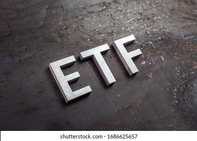 The Abbreviation Word Etf - Exchange Traded Fund - Laid With Silver Letters On Raw Rusted Steel Sheet Surface In Slanted Diagonal Perspective