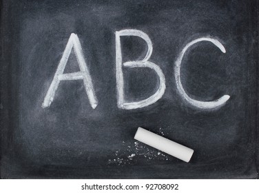 ABC Letters And Chalk On Blackboard