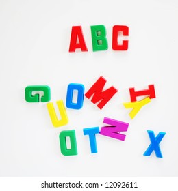 ABC Written On Fridge Door With Fridge Magnet Alphabet Letters.