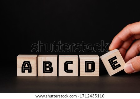 ABCDE wooden blocks and black background