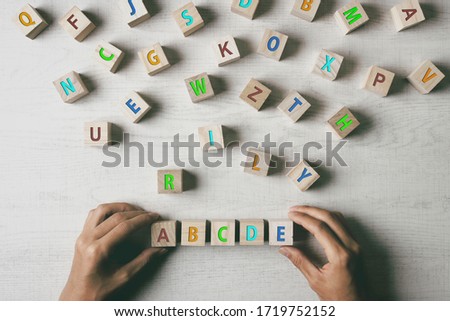 ABCDE wooden blocks and colorful alphabet