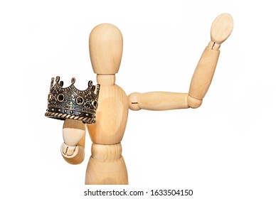 Abdication Concept. Wooden Dummy Holding A Crown. Mannequin With Crown.