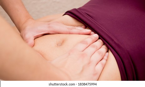 Abdominal Massage In Female Physiotherapy Patient.