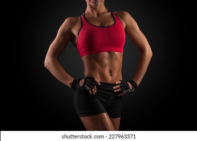 Abdominal Muscles Of Young Sporty Woman. Woman Professional Body Builder