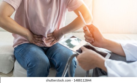 Abdominal pain patient woman having medical exam with doctor on illness from stomach cancer, irritable bowel syndrome, pelvic discomfort, Indigestion, Diarrhea, GERD (gastro-esophageal reflux disease)