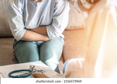 Abdominal Pain Patient Woman Having Medical Exam With Doctor On Illness From Stomach Cancer, Irritable Bowel Syndrome, Pelvic Discomfort, Indigestion, Diarrhea, GERD (gastro-esophageal Reflux Disease)