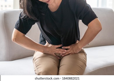 Abdominal Pain In Woman With Stomachache Illness From Menstruation Cramps, Stomach Cancer, Irritable Bowel Syndrome, Pelvic Discomfort, Indigestion, Diarrhea Or GERD (gastro-esophageal Reflux Disease)