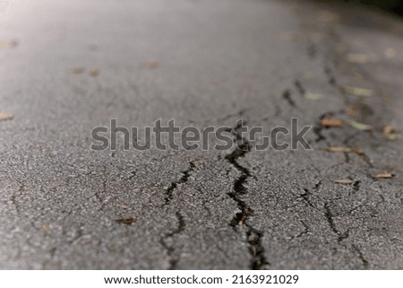 Cracks in asphalt Pothole