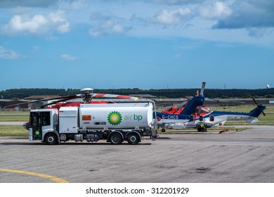 ABERDEEN, SCOTLAND - AUGUST 30 2015: Helicopter Receives Fuel By BP Tanker