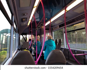 Aberdeen, Scotland / UK - October 19, 2019 : Interior Scene Of FirstGroup Bus, With Passengers Heading Toward The Door To Get Off The Bus.