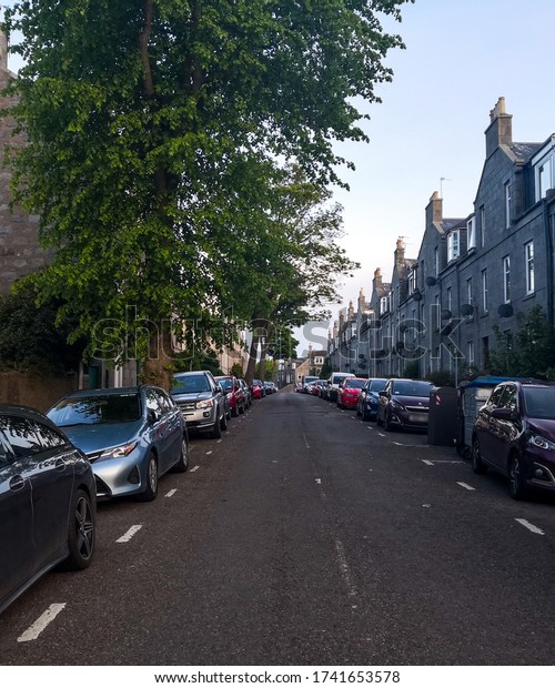 Aberdeen,\
Scotland/UK - May 21 2020: Empty streets during Coronavirus\
lockdown in Scotland with parked\
cars.