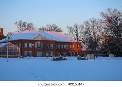 Aberdeen, South Dakota / USA - September 5 2013: A Landscape Of A Building Surrounded By Snow At Northern State University