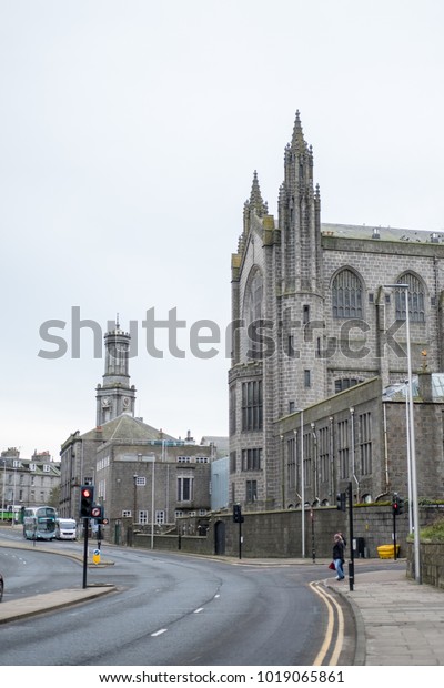 Aberdeen, United Kingdom - 8 November 2017: View\
of Building and cars along the street in Aberdeen. It is a port\
city in northeast\
Scotland