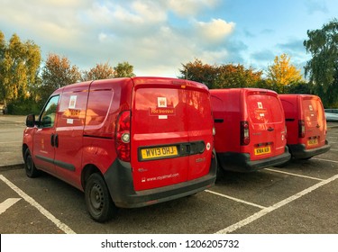 ABERGAVENNY, WALES - OCTOBER 2018: Row Of Royal Mail Post Office Delivery Vans Parked Near The Town's Postal Sorting Office In Evening Sunlight.