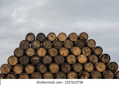Aberlour, SCOTLAND - OCT 18, 2018: Stacked pile of wooden barrels and casks at Speyside Cooperage, home of the ancient art of coopering since 1947.
